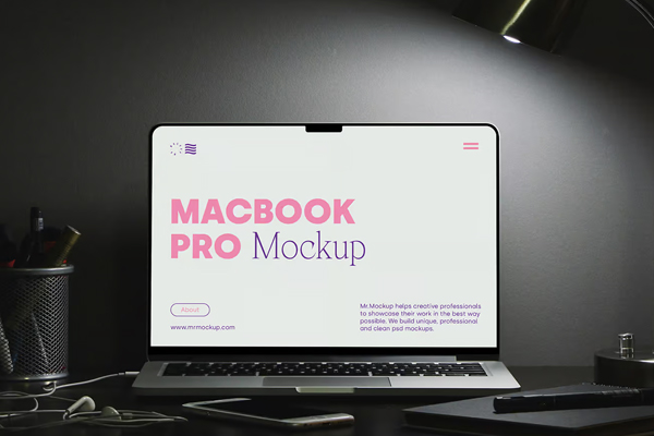 Free MacBook Pro on Black Desk Mockup PSD Template