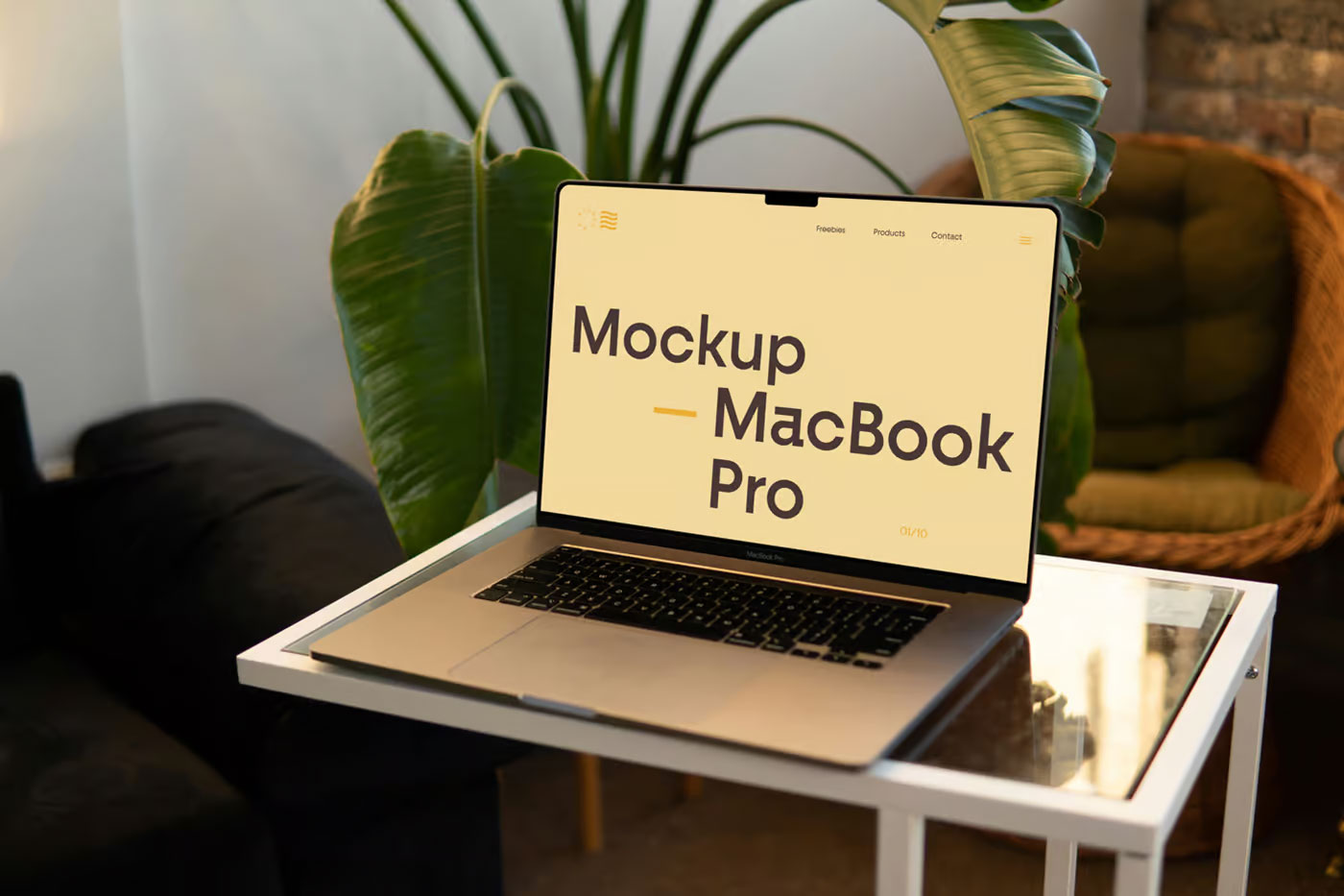 Free MacBook Pro on Small Table Mockup PSD Template
