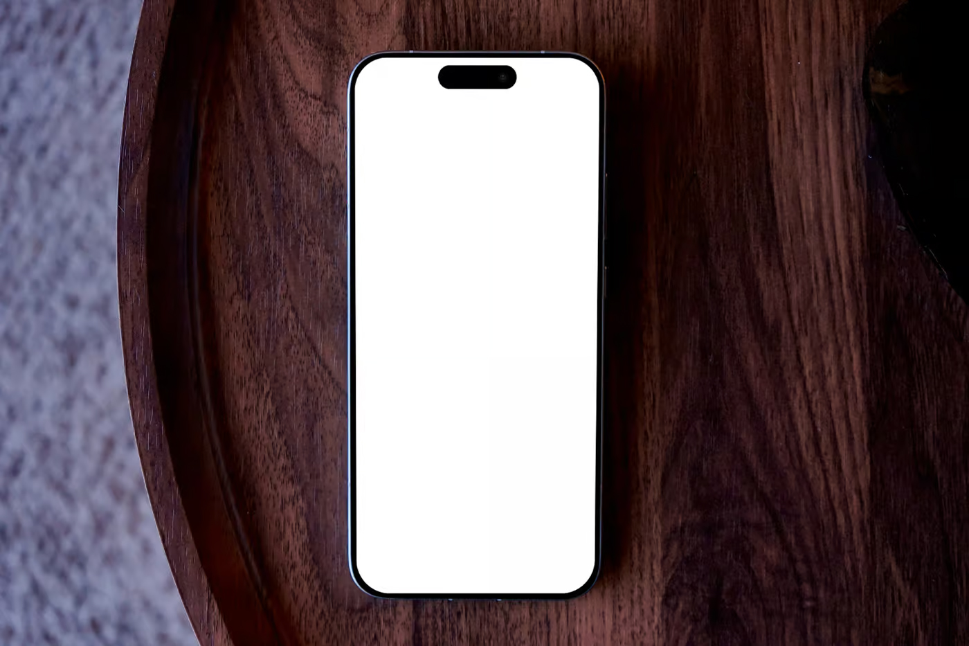 Free iPhone Lying on Wooden Table Mockup PSD Template
