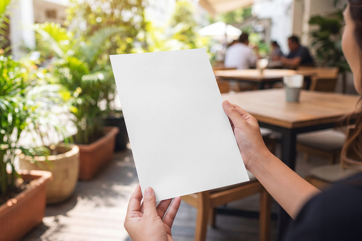 Free Menu Card in Hands Mockup PSD Template